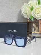 Chanel sunglasses with navy frame and light blue lenses