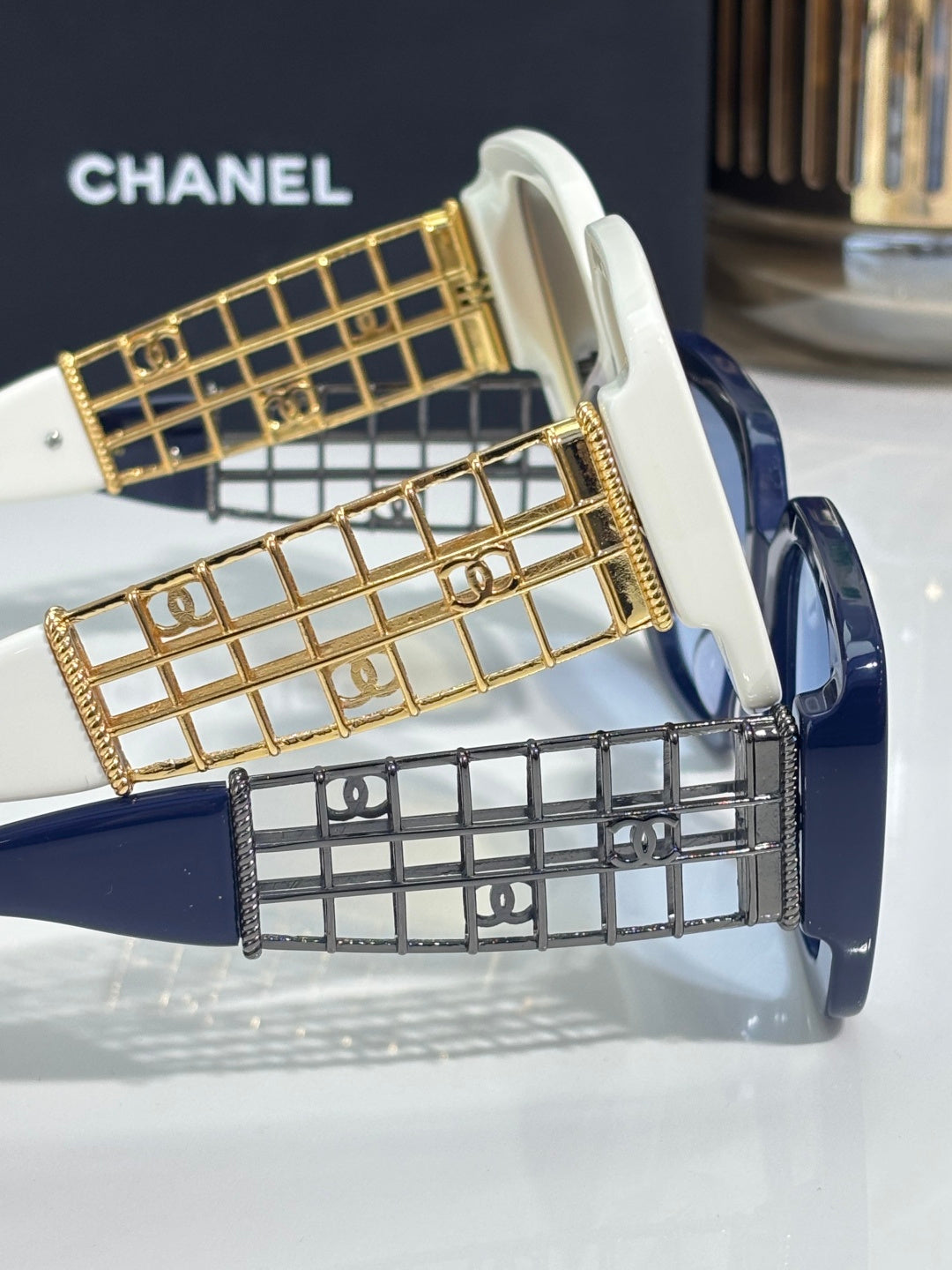 Chanel sunglasses with gold grid temple detail