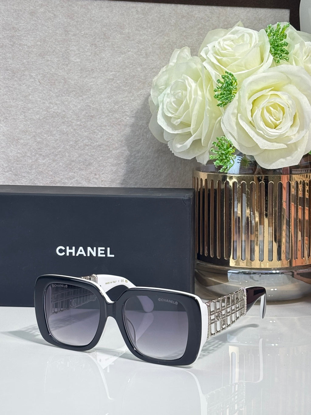Chanel sunglasses with dark blue frame and gray lenses