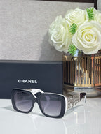 Chanel sunglasses with dark blue frame and gray lenses