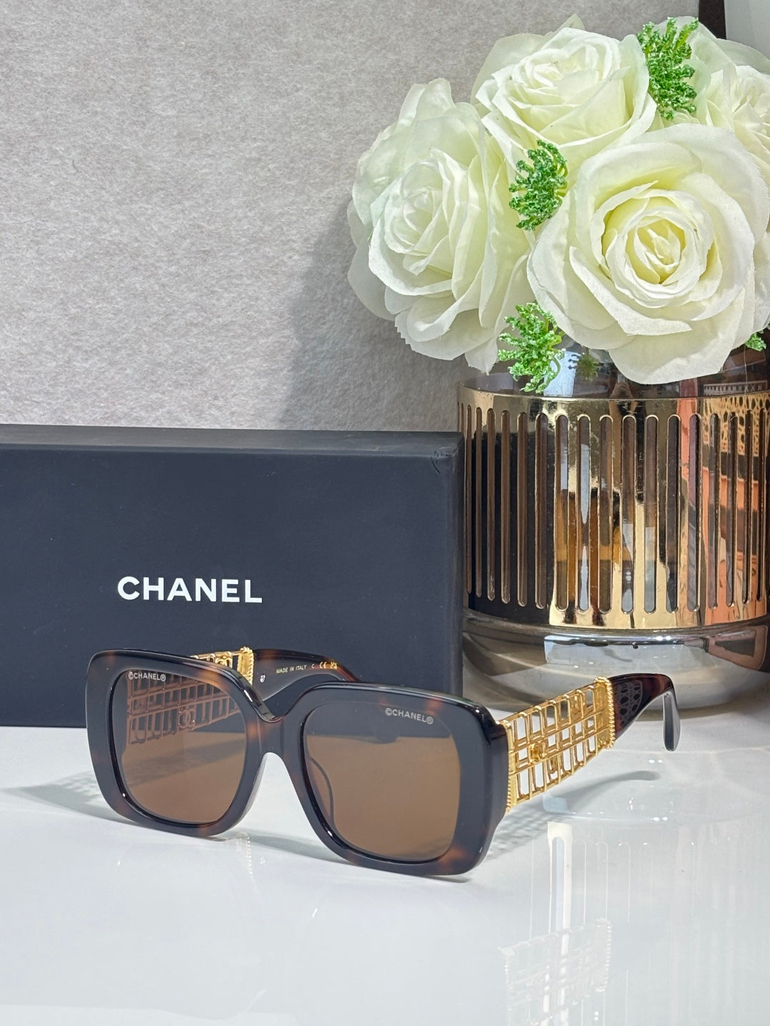 Chanel sunglasses with navy frame and brown square lenses