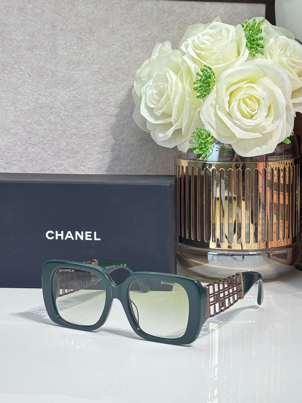 Chanel sunglasses with teal frame and light lenses