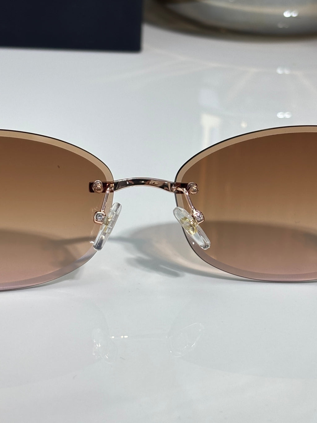 Chanel sunglasses close-up of rose gradient lenses and metal bridge
