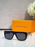 Black square sunglasses with tinted lenses and gold-tone logo on temples
