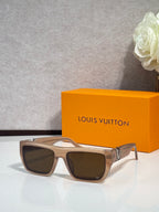 Louis Vuitton sunglasses with light beige frame, dark lenses, and gold-tone accents