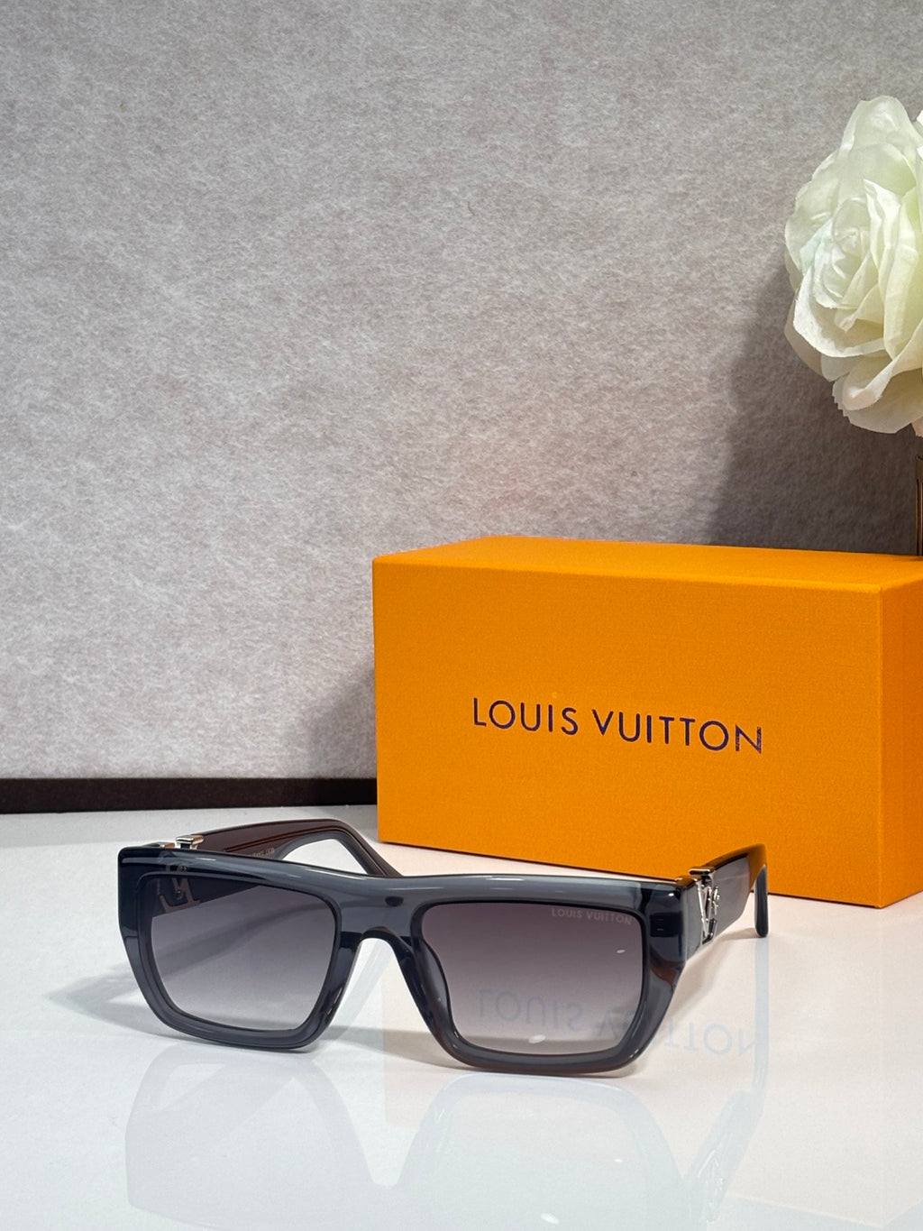 Louis Vuitton sunglasses with black frame and tinted lenses