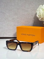 Louis Vuitton sunglasses with dark tortoiseshell frame and tinted lenses