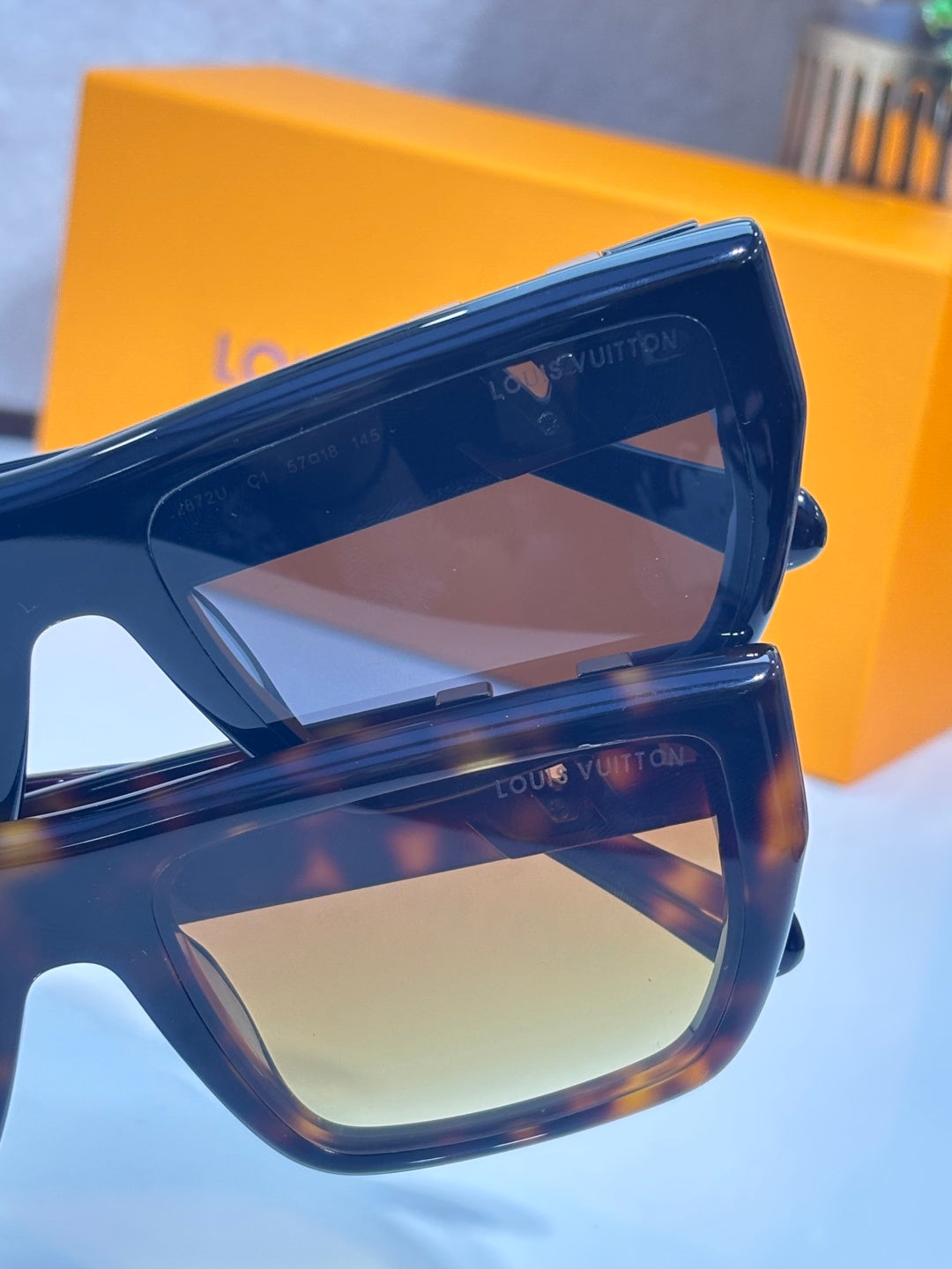 Louis Vuitton sunglasses close-up: blue frame with brown-tinted lenses and logo