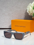 Louis Vuitton sunglasses with dark blue/black frame and tinted lenses