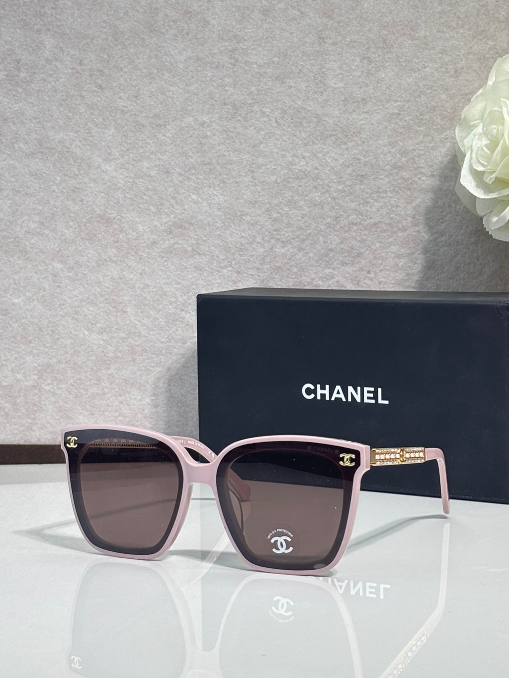 Chanel cat-eye sunglasses with pink-toned frames and dark lenses