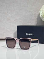 Chanel cat-eye sunglasses with pink-toned frames and dark lenses