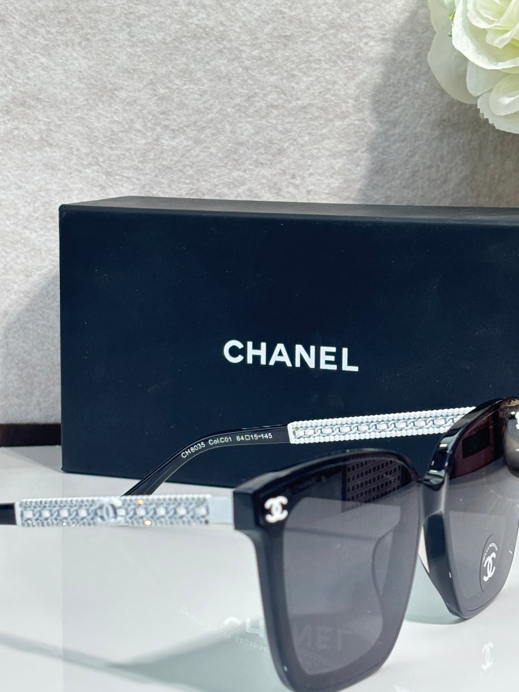 Chanel sunglasses with rhinestone logo temple and dark lenses