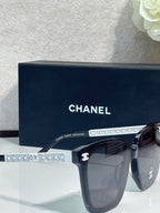 Chanel sunglasses with rhinestone logo temple and dark lenses