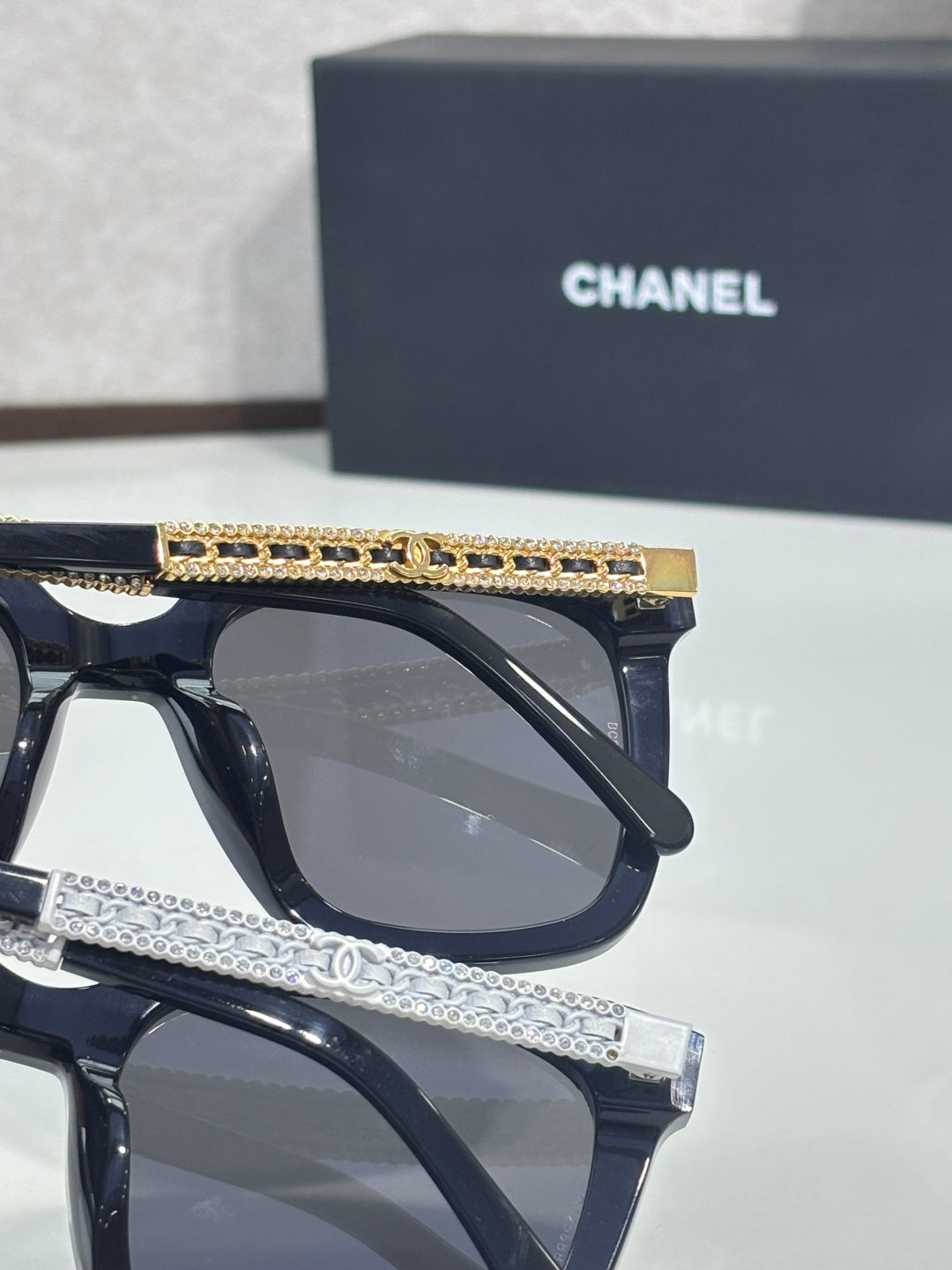 Chanel oversized sunglasses with black frames and rhinestone-accent temples