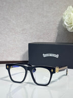Chrome glasses with dark frames and gold-tone side emblem accents
