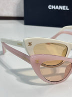 Chanel cat-eye sunglasses with pink and cream frames and beige gradient lenses