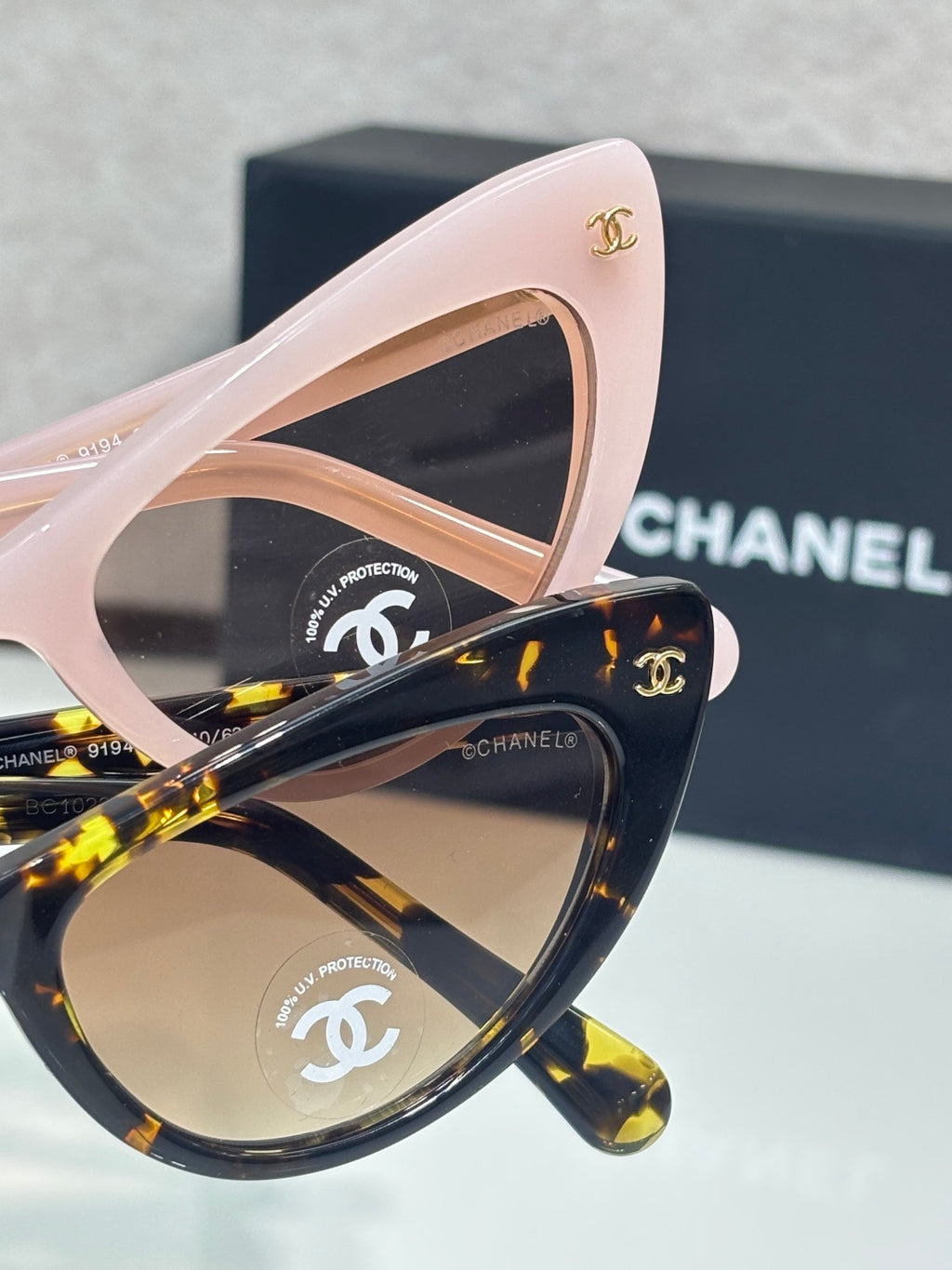 Chanel cat-eye sunglasses set with pink frames and dark tortoiseshell lenses