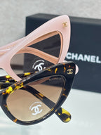 Chanel cat-eye sunglasses set with pink frames and dark tortoiseshell lenses