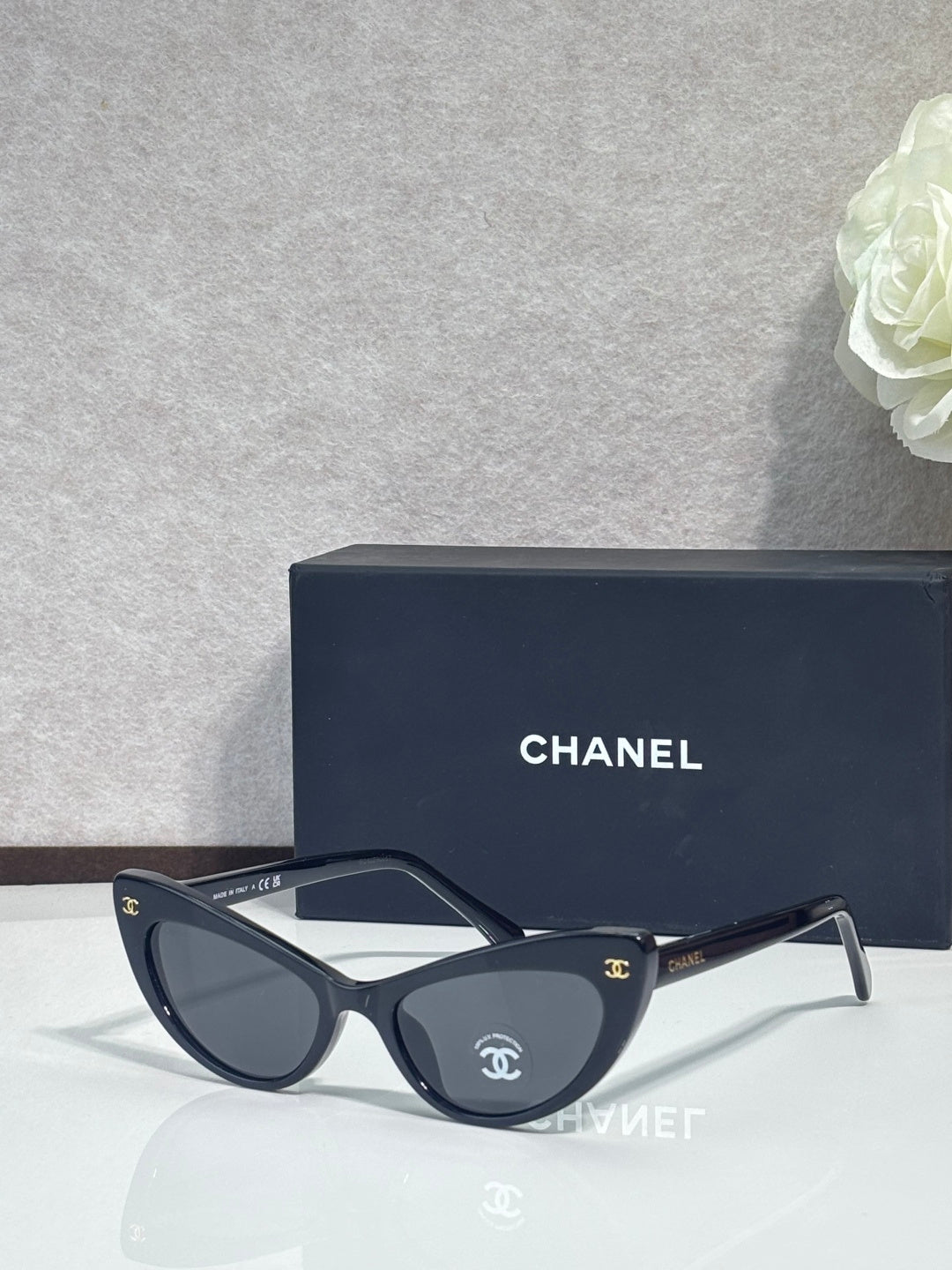 Chanel cat-eye sunglasses with dark tortoiseshell frames and dark tinted lenses