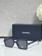 Chanel sunglasses with dark gray frames and dark lenses