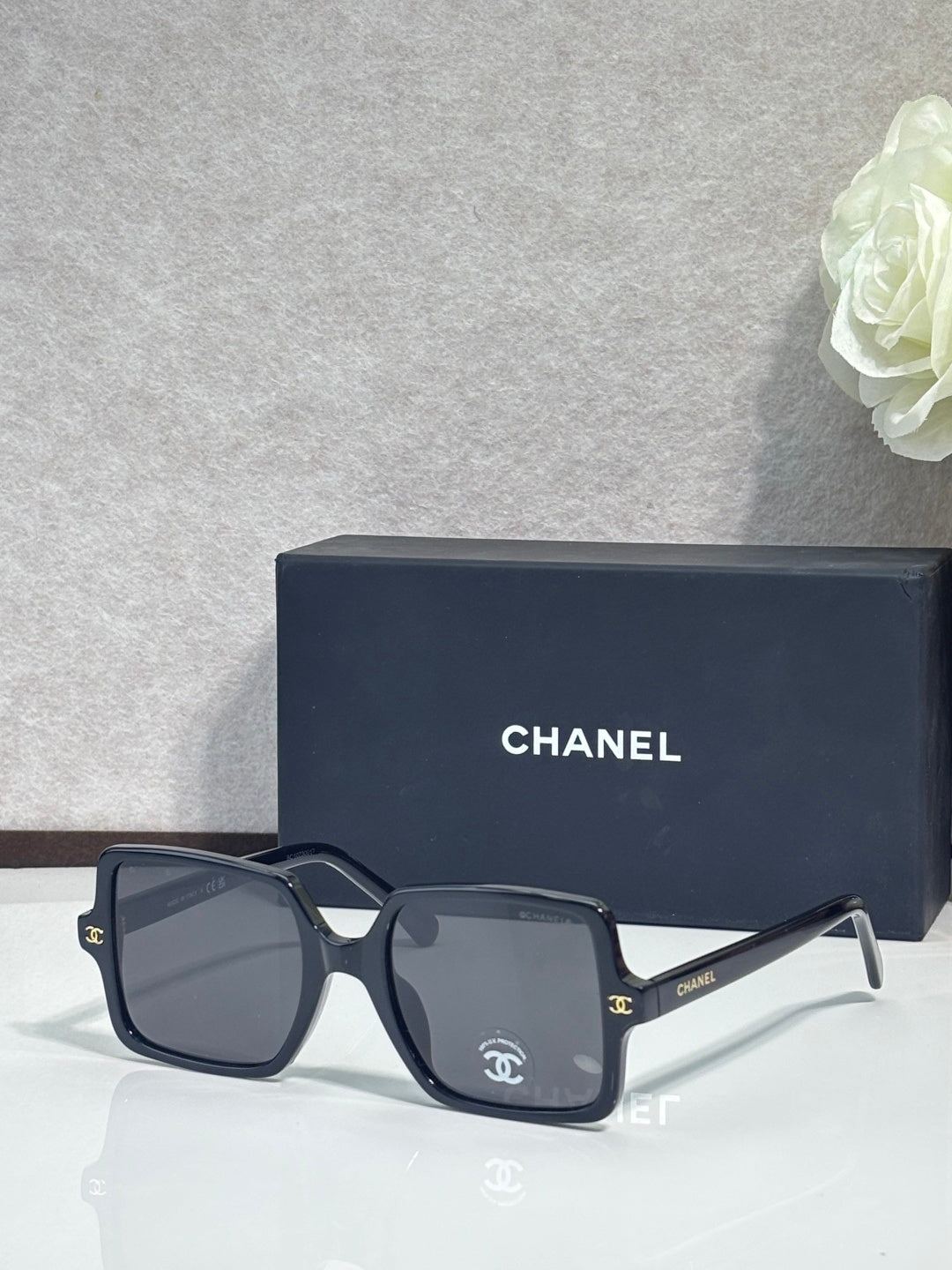 Chanel sunglasses with dark gray frames and dark lenses