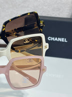 Chanel sunglasses with light pink frames and brown tinted lenses