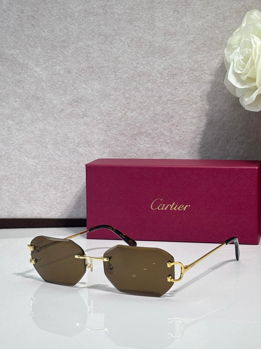Cartier sunglasses with olive-brown tinted lenses and gold-tone metal frames