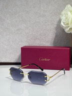 Cartier sunglasses with blue tinted lenses and gold-tone metal frames