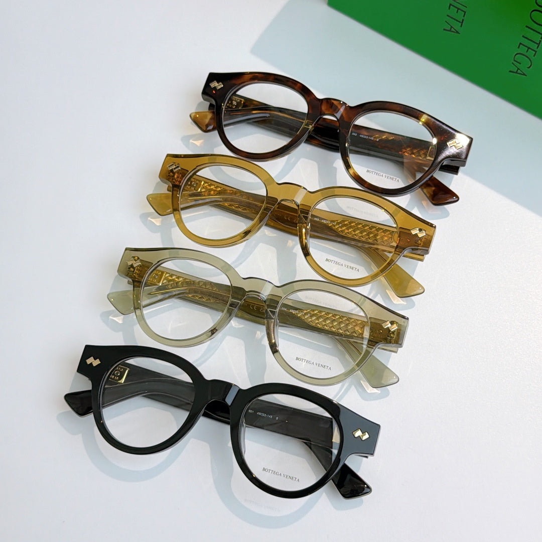 Group of round acetate eyeglasses in tortoiseshell, gold, olive, and black colors