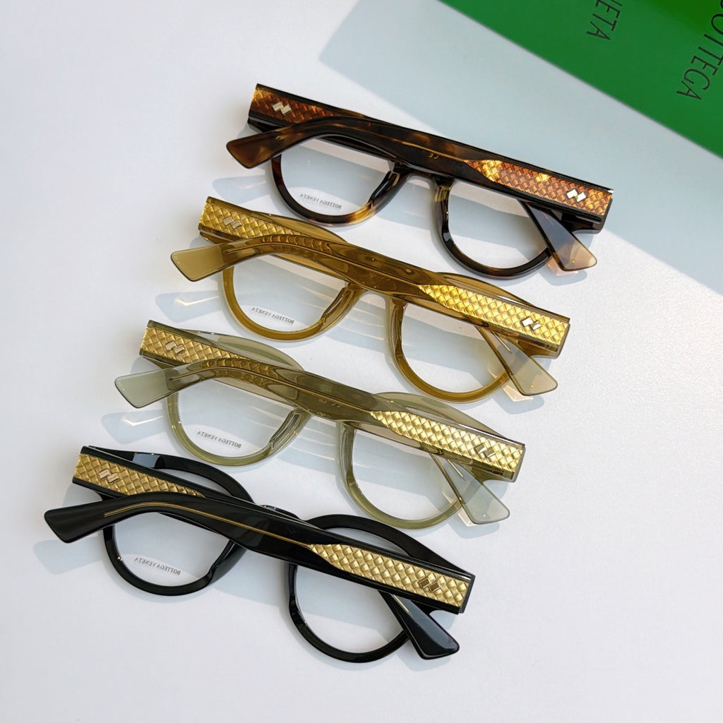 Assorted eyeglasses set with tortoiseshell, gold, and black frames and textured temples