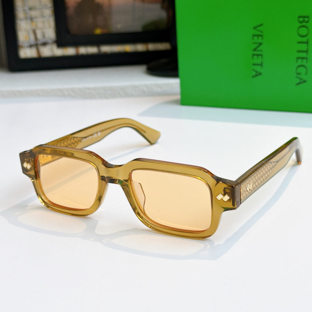 Bottega Veneta sunglasses, clear amber frames with gold textured temples
