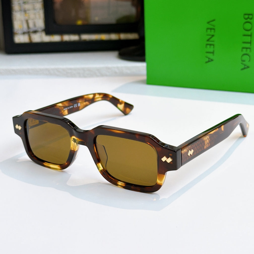 Bottega Veneta sunglasses, tortoiseshell frames with amber-tinted lenses