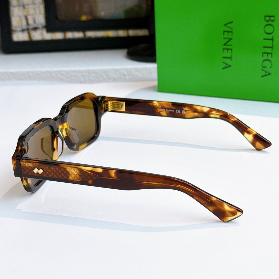 Bottega Veneta sunglasses, tortoiseshell frames with amber lenses and gold accents
