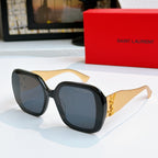 YSL sunglasses with black frames and dark tinted lenses, gold logo detail on temples.