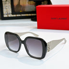 YSL sunglasses with black frames and dark purple tinted lenses, gold logo detail on temples.