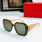YSL sunglasses with tortoiseshell frames and dark green tinted lenses, gold logo detail.