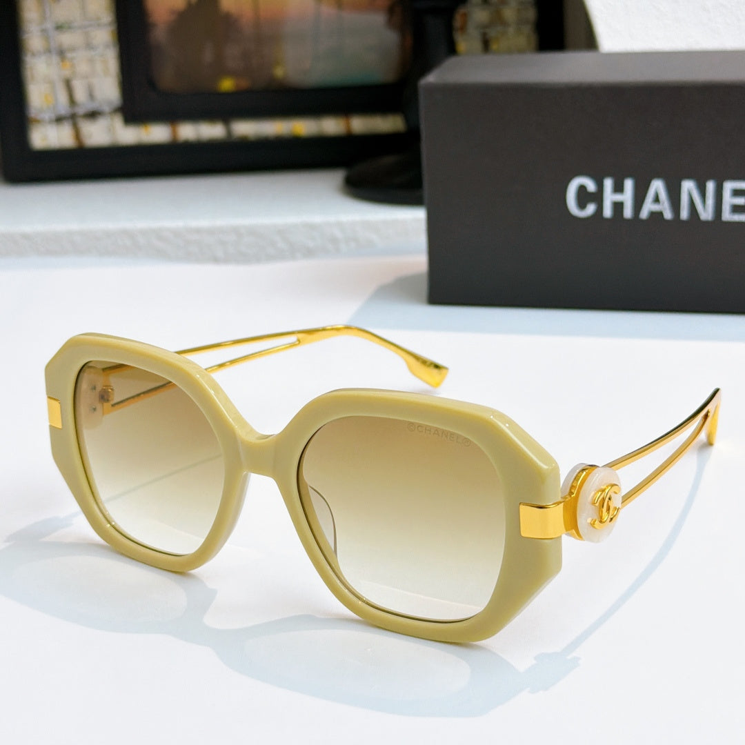 Chanel sunglasses with cream frames and light tinted lenses