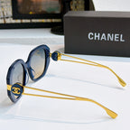 Chanel sunglasses with blue frames, gold-tone accents, and tinted lenses