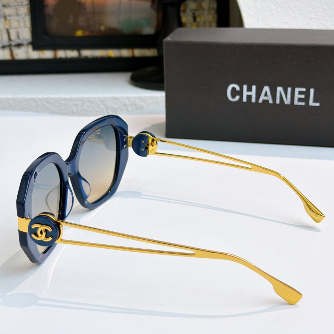 Chanel sunglasses with blue frames, gold-tone accents, and tinted lenses