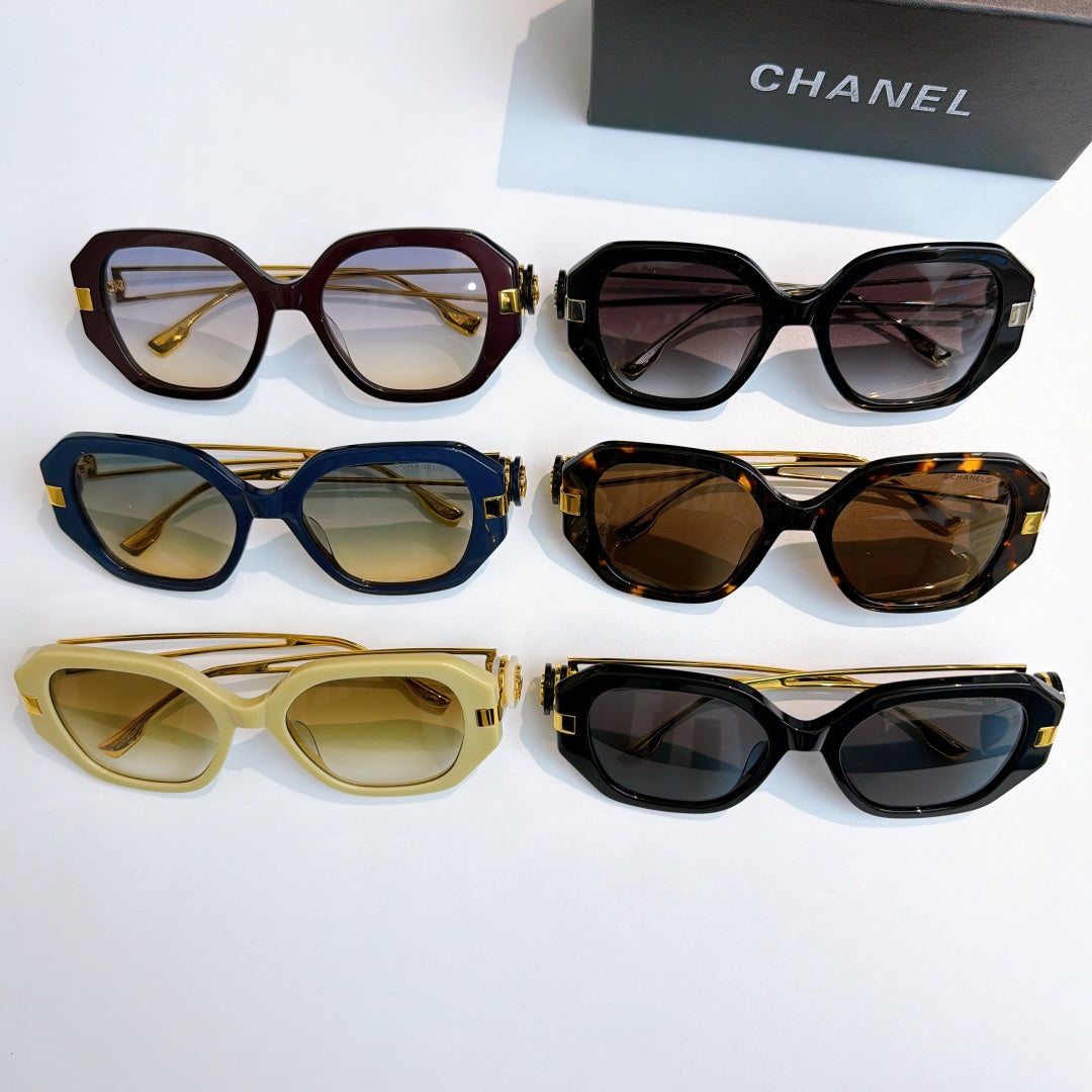 Chanel sunglasses display with multiple frame colors and tinted lenses