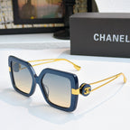 Square sunglasses with dark blue frames and gold-tone logo arms