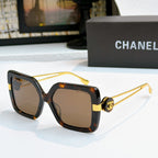 Square sunglasses with dark tortoise frames and gold-tone logo arms