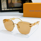 Louis Vuitton cat-eye sunglasses with gold frame and warm amber gradient lenses