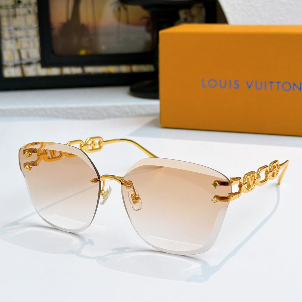 Louis Vuitton cat-eye sunglasses with gold frame and light amber gradient lenses
