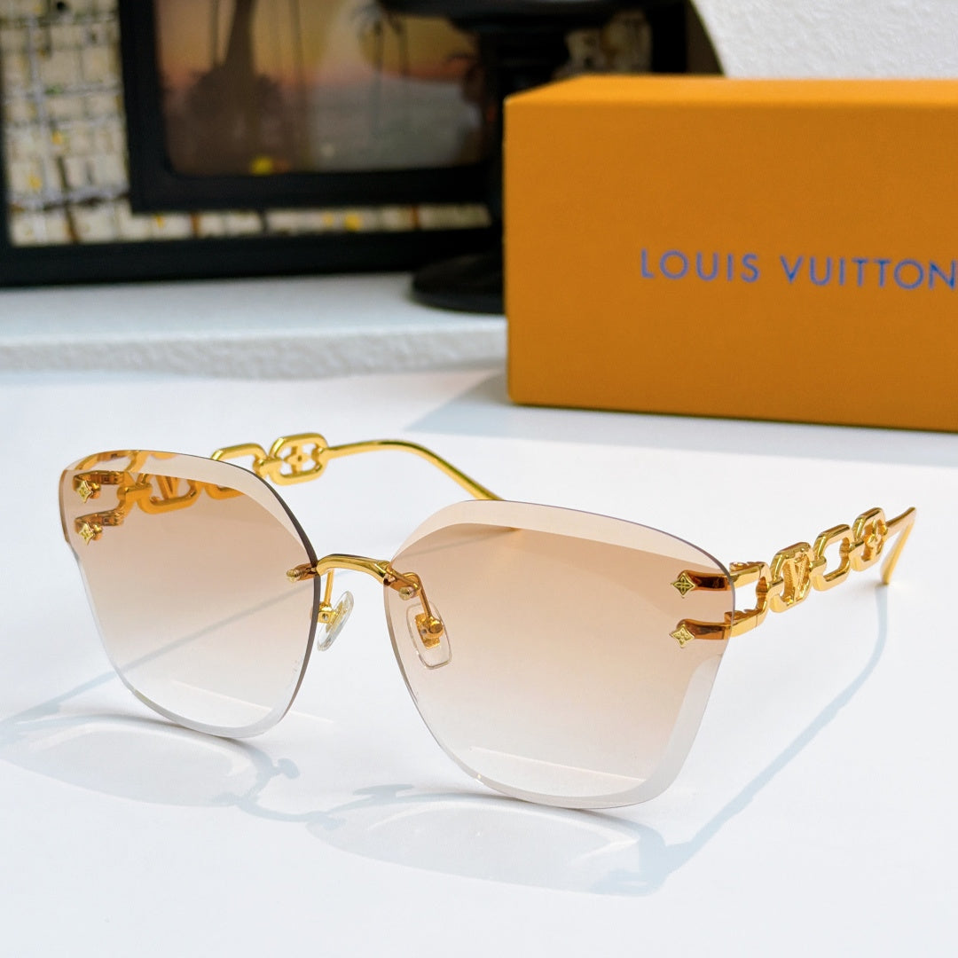 Louis Vuitton cat-eye sunglasses with gold frame and light amber gradient lenses