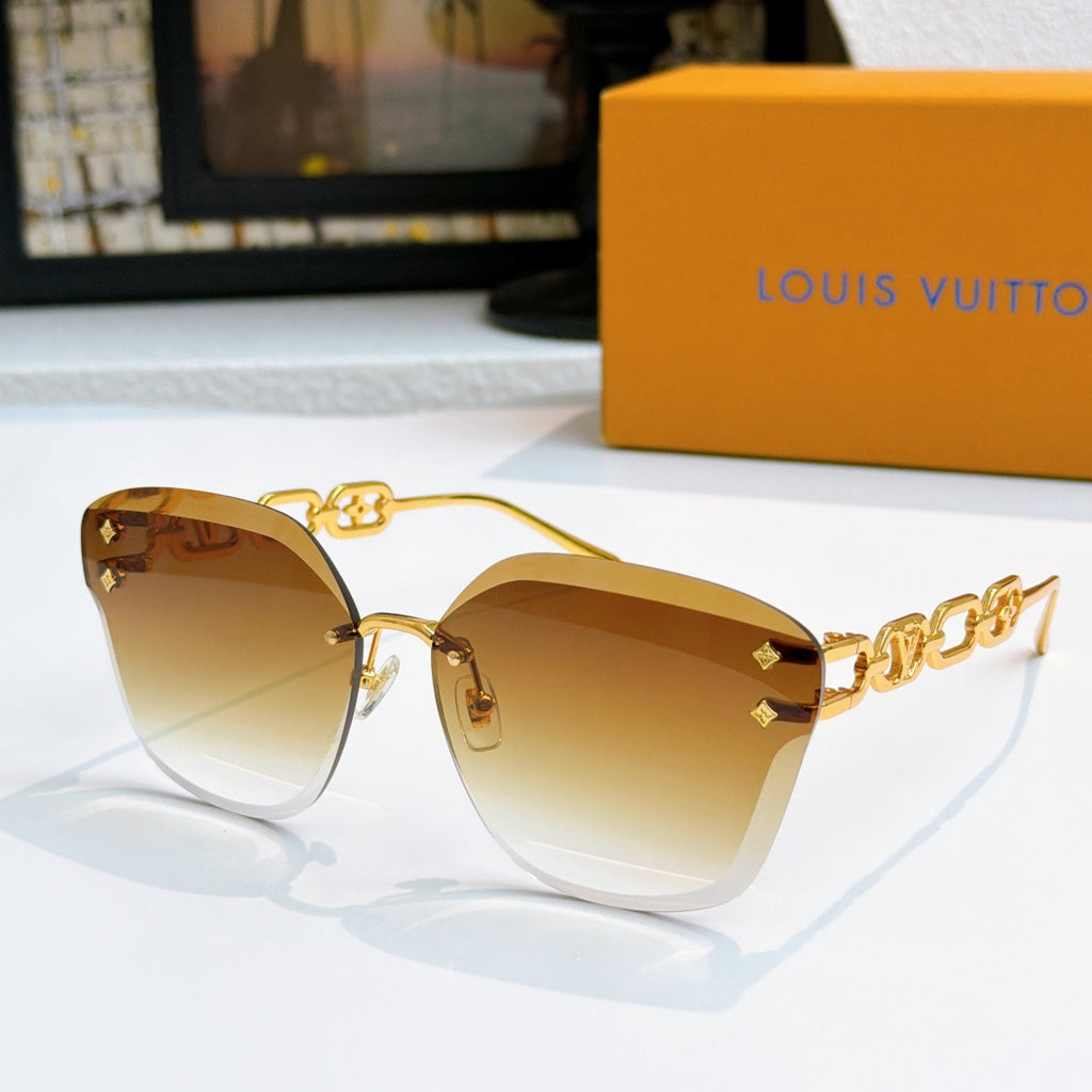 Louis Vuitton cat-eye sunglasses with gold frame and amber gradient lenses