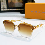 Louis Vuitton cat-eye sunglasses with gold frame and amber gradient lenses