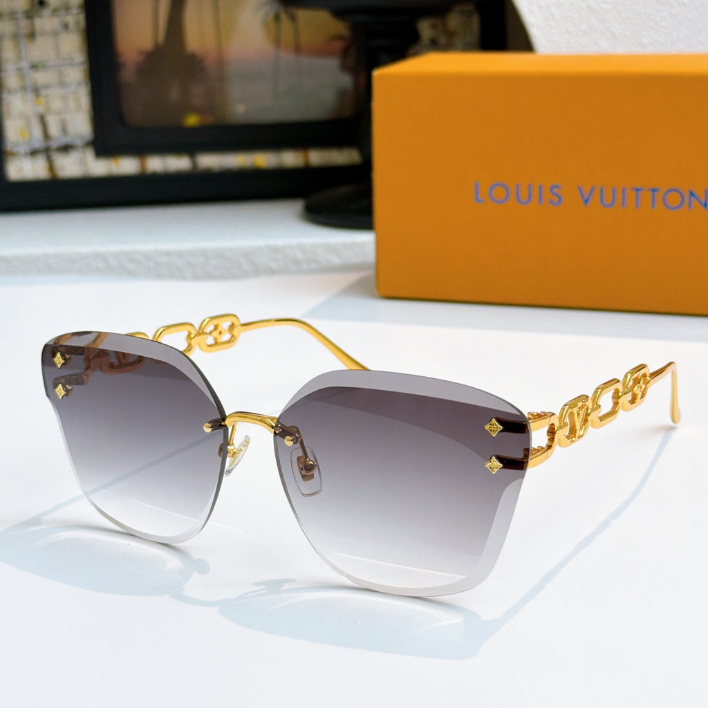 Louis Vuitton cat-eye sunglasses with gold frame and dark smoky gradient lenses