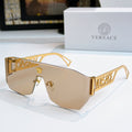 Gold sunglasses with amber mirrored lenses and Versace logo arms