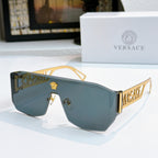Gold-framed sunglasses with blue mirrored lenses and Versace logo arms